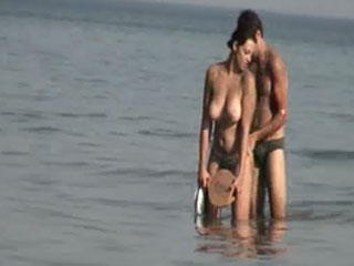 Big boobs topless in midle of sea