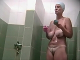 Busty MILF in public shower