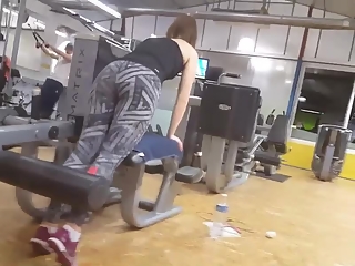 Woman in yoga pants exercising