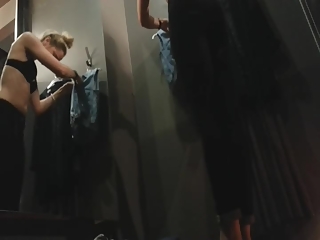 Blonde girl caught trying clothes