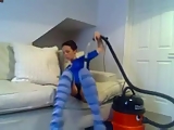Housewife bating with a vacuum