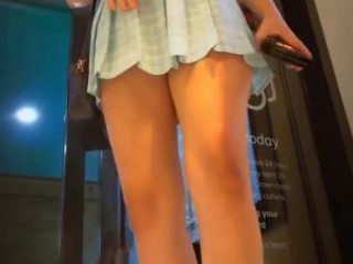 Teens in miniskirts in the shopping mall