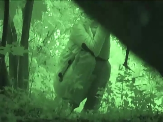 Woman pissing in the forest almost falls
