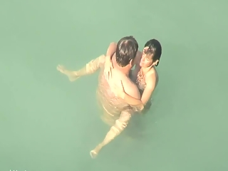 Nudist sex in the water