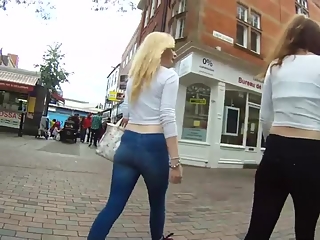 Blonde and brunette teens wearing tight pants