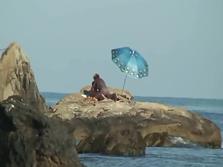 Couple caught fucking in the rocks