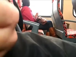 Guy strokes his cock in train