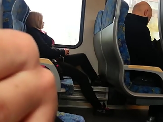Guy plays with his cock next to female passenger