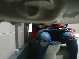 Concealed camera in public toilet catches ebony girl