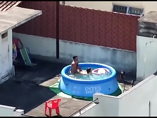 Man and woman fucking in the pool