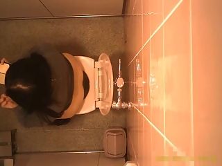 Hidden camera in the public toilet ceiling