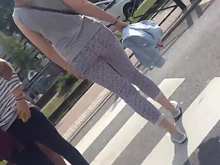 Tight pants girl goes to metro stop
