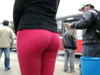 Wating for the bus in red leggings
