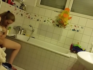 Chubby girl spied in bathroom peeing and washing pussy