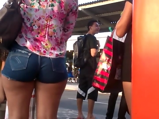 Woman with nice booty in tight shorts