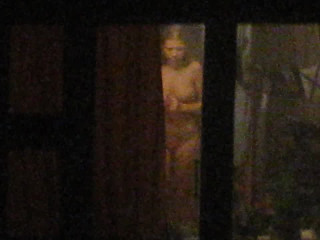 Topless neighbor closes window