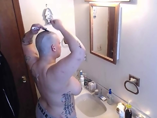 Chubby tattooed shaving head