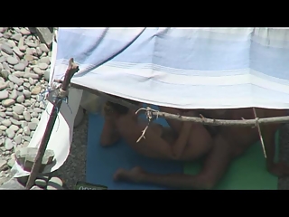 Nudist couple caught fucking under tent