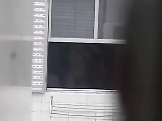 Spy on topless neighbor