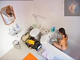 girl changes in bathroom