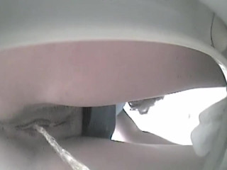 Toilet films pee out of pussy