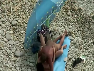 Nudist couple fucking in the shore