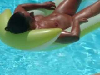 Wife sunbathing in pool