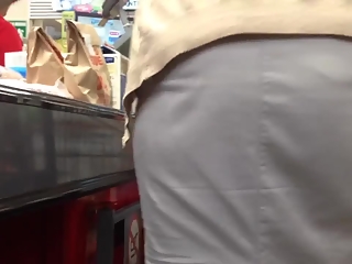 Upskirt at woman in supermarket