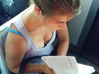 Blonde chick reading book down blouse