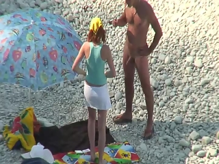 Nudist couple goes take a swim