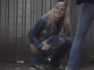 Blonde and brunette girls caught peeing outdoors