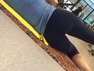 Woman exercising legs in tight sports pants