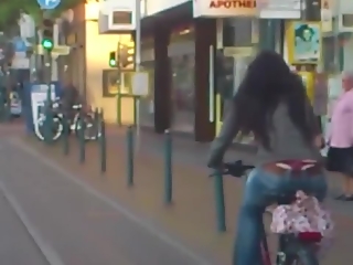 Red thong woman riding bike