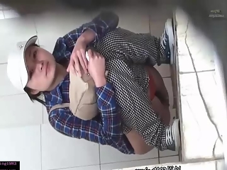 Asian woman caught peeing in bathroom