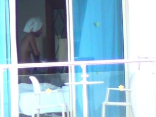 Nude lady in hotel bedroom