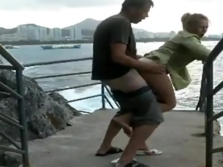 Couple fucking outdoors in public by the ocean