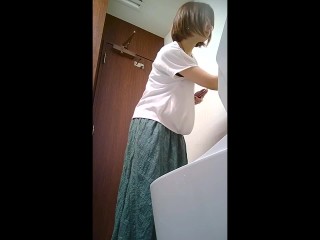 Asian looks in toilet and pees