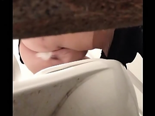 Two women in public toilet cabin spied peeing