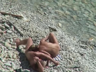 Nudist couple fucking in the shore