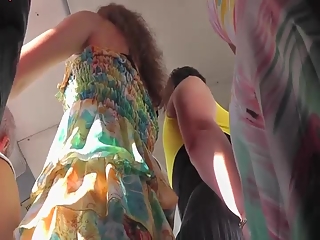 Chick in colorful dress bus upskirt