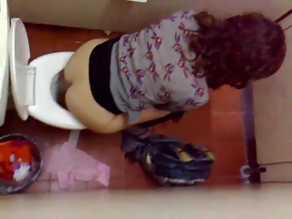 Voyeur filming over the toilet division women peeing
