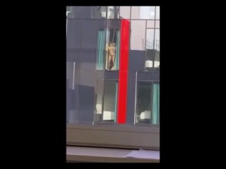 Couple sex against hotel window