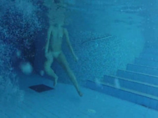 Nudist lady in nudist pool