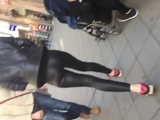 Woman in tight leather pants
