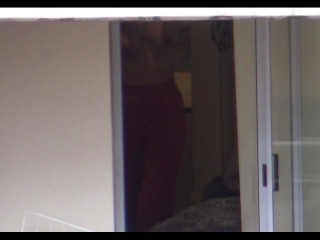 Topless lady in red pants