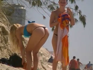 Topless girl in thong bikini