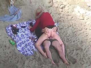 Clothed woman fucked in the beach