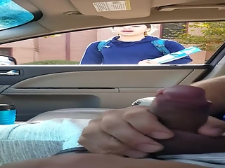 Guy plays with his dick inside car