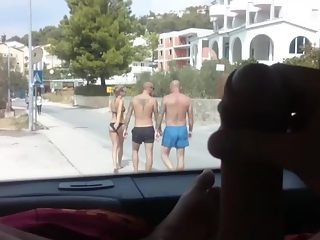 Exhibitionist dude plays with his cock in the car trunk